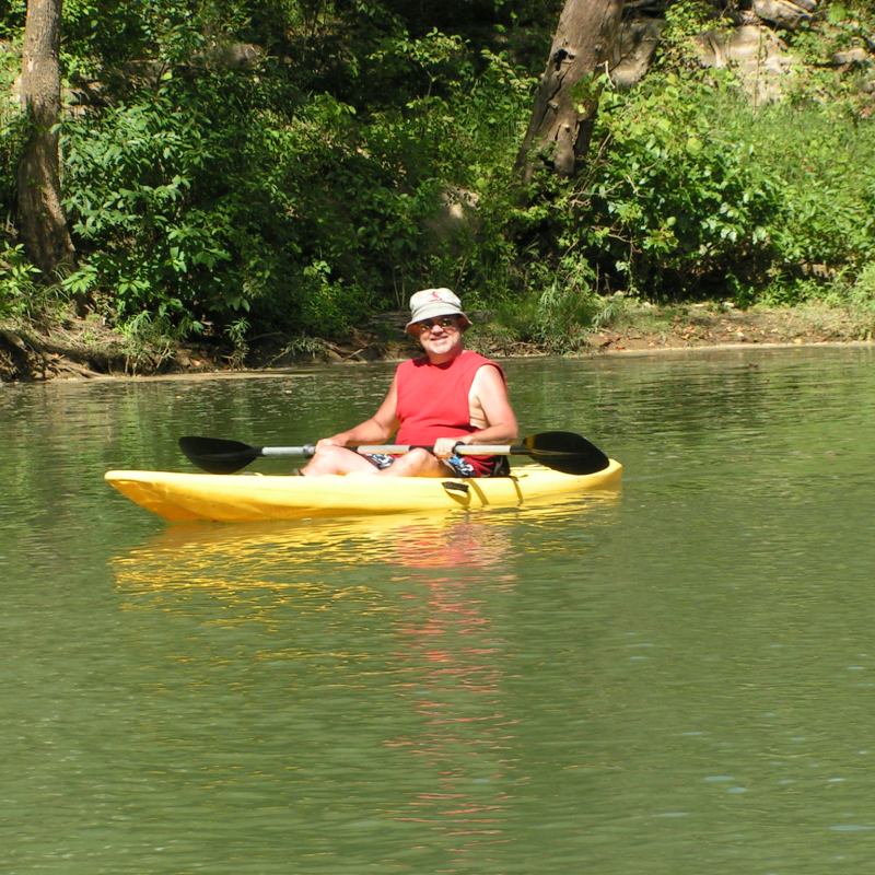 A older man in a kayak on the Meramec River