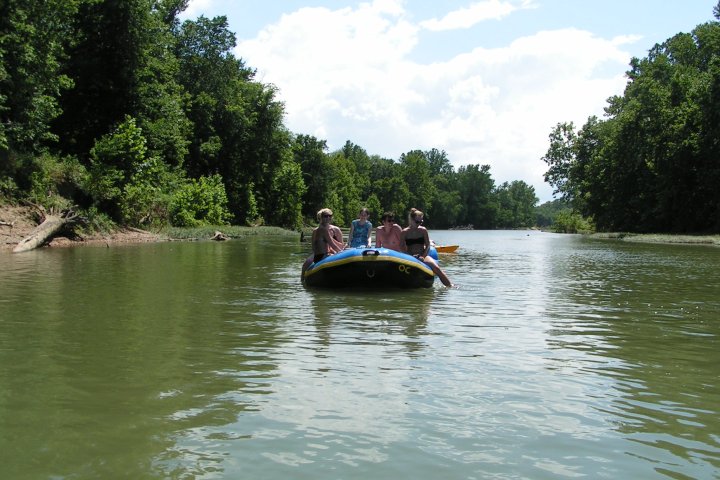 People floating on the Meramec River in a raft