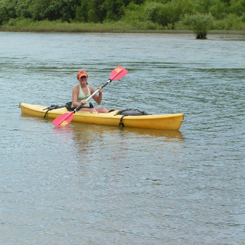 A woman paddling her kayak