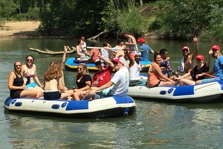 Three groups of people enjoying a cooler float on the Meramec River