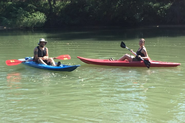 Two people enjoying a kayak trip on the Meramec River