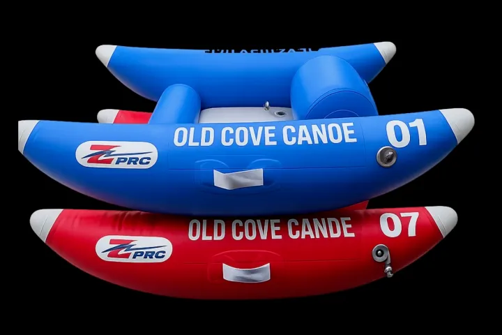 Two inflatable canoes stacked, red and blue, labeled 'Old Cove Canoe'.